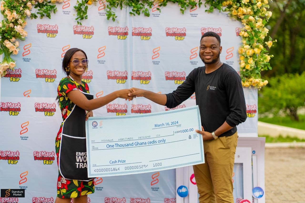 Cash prize cheque handover at the Sigmart YAE Fair 2024